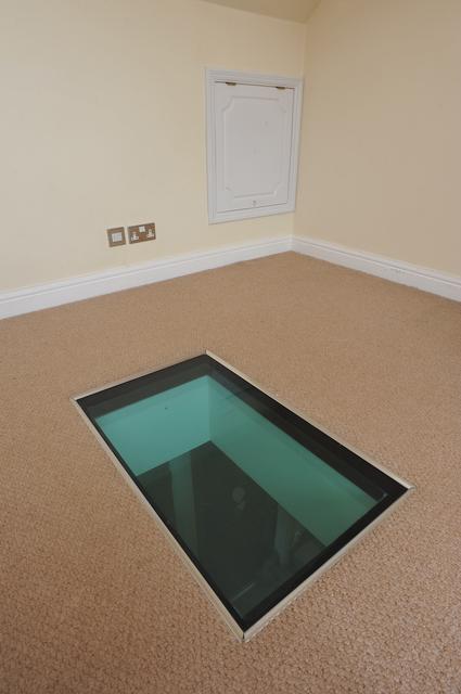 piece of glass in floor to walk on in loft conversion 